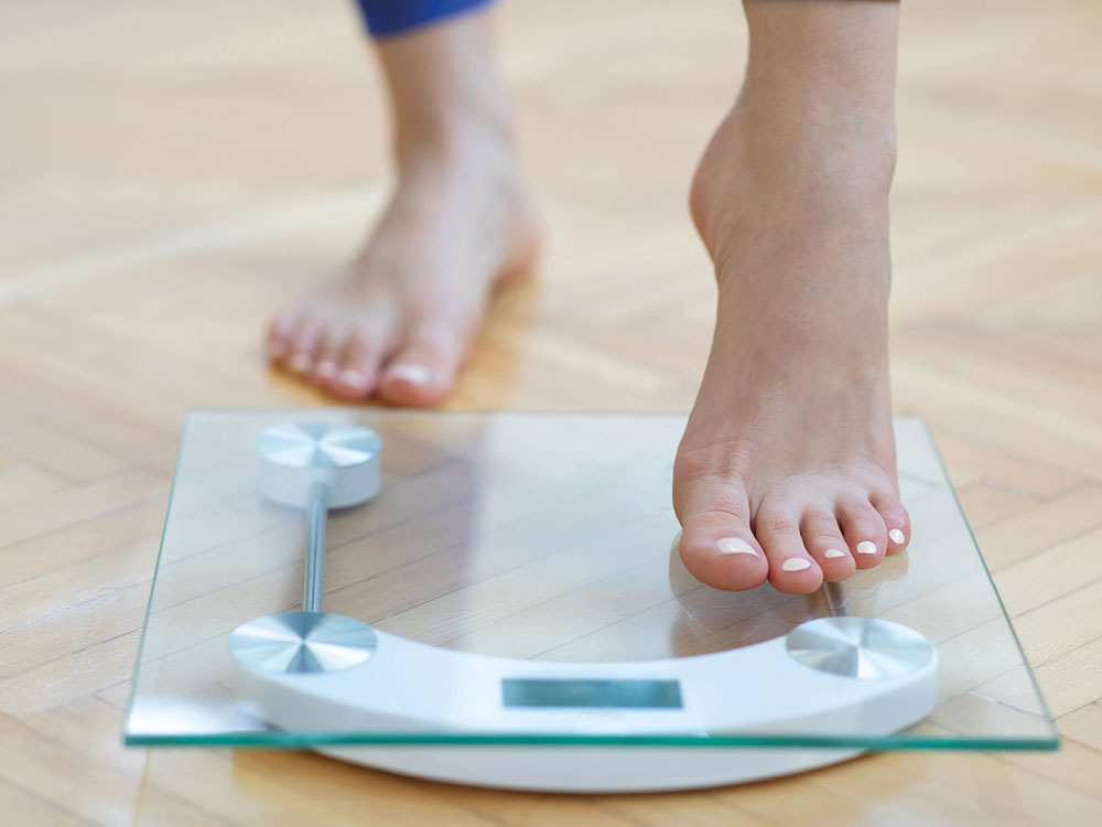 Person stepping on scales