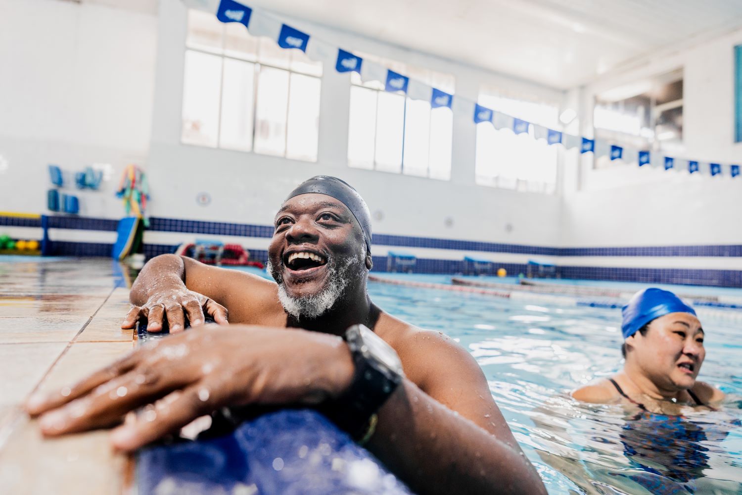 A man swimming at the pool