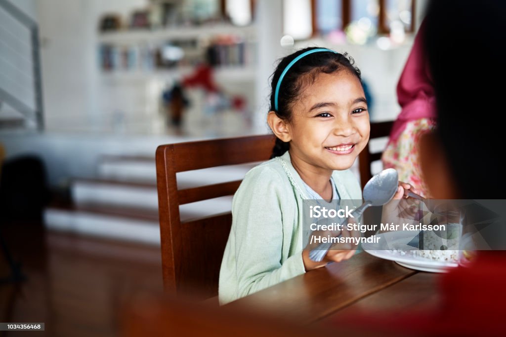 Little girl eating dinner