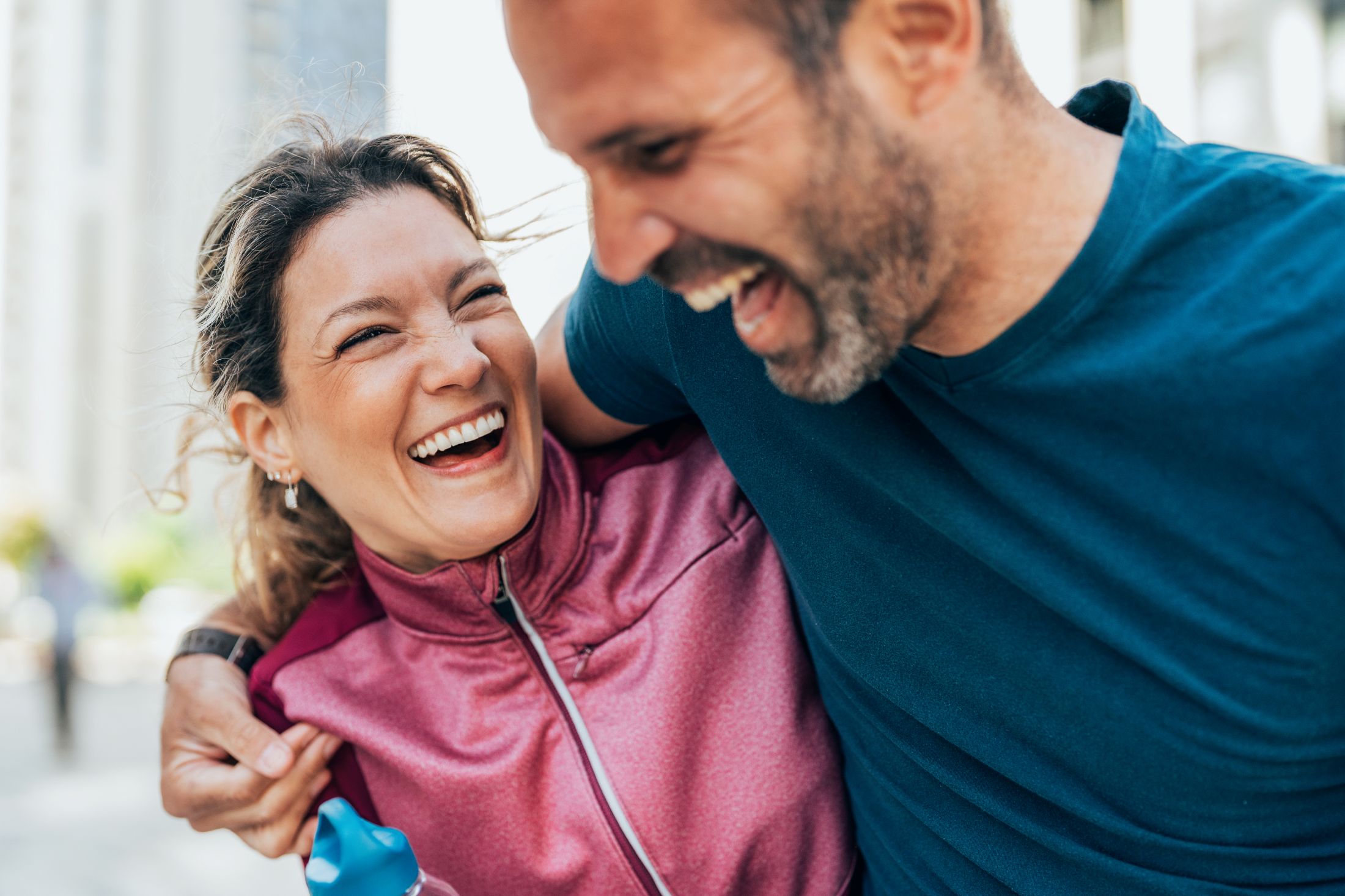A man and woman laughing